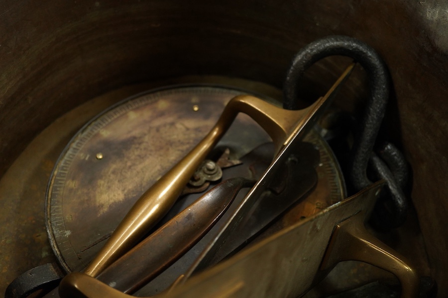 A collection of metalware to include a Victorian copper pan, a figural cast iron doorstop- 39cm high, brass door handles etc